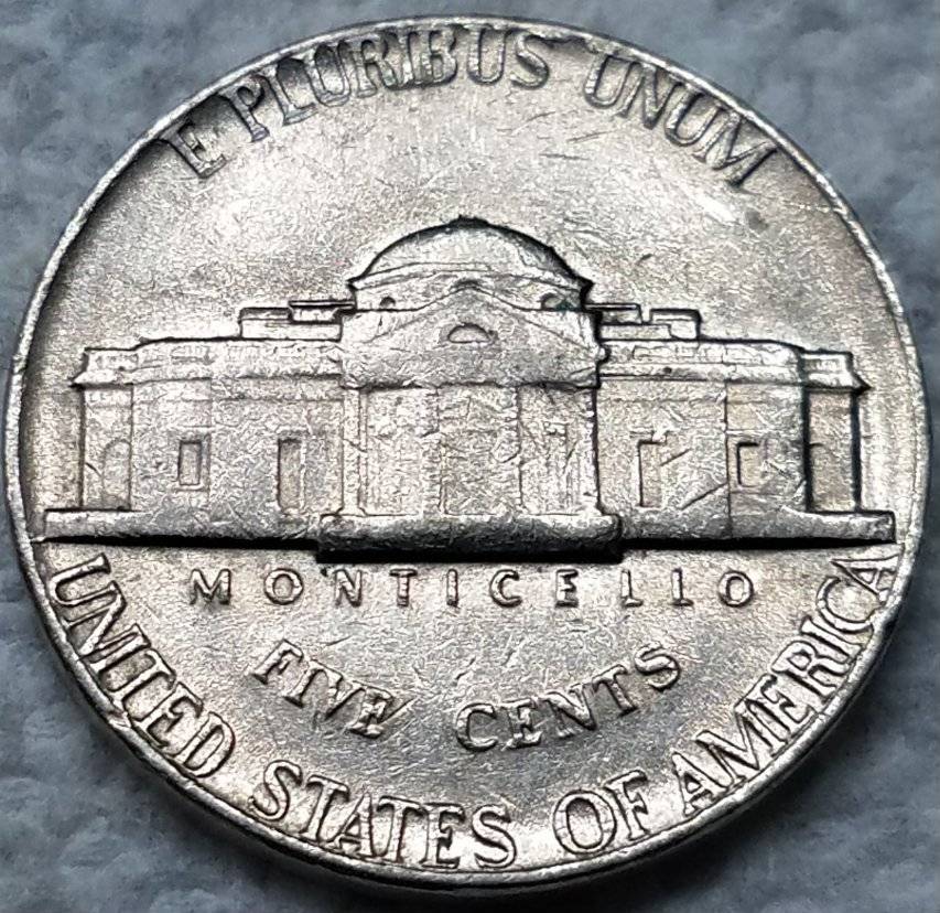 1976-D-Jefferson-Nickel-Tilted-Die-Strike-Under-Jaw-On-Obverse?